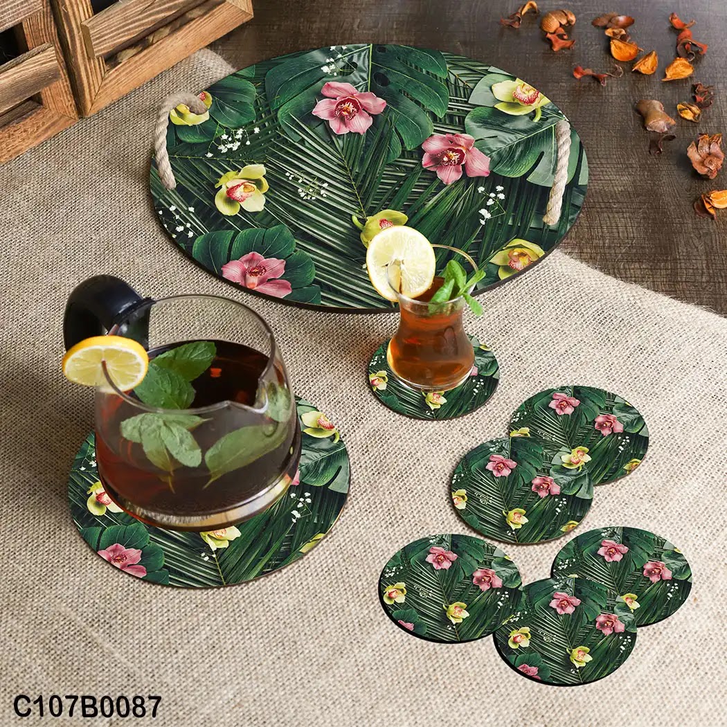 Circular tray set with small colored roses and green tropical leaves