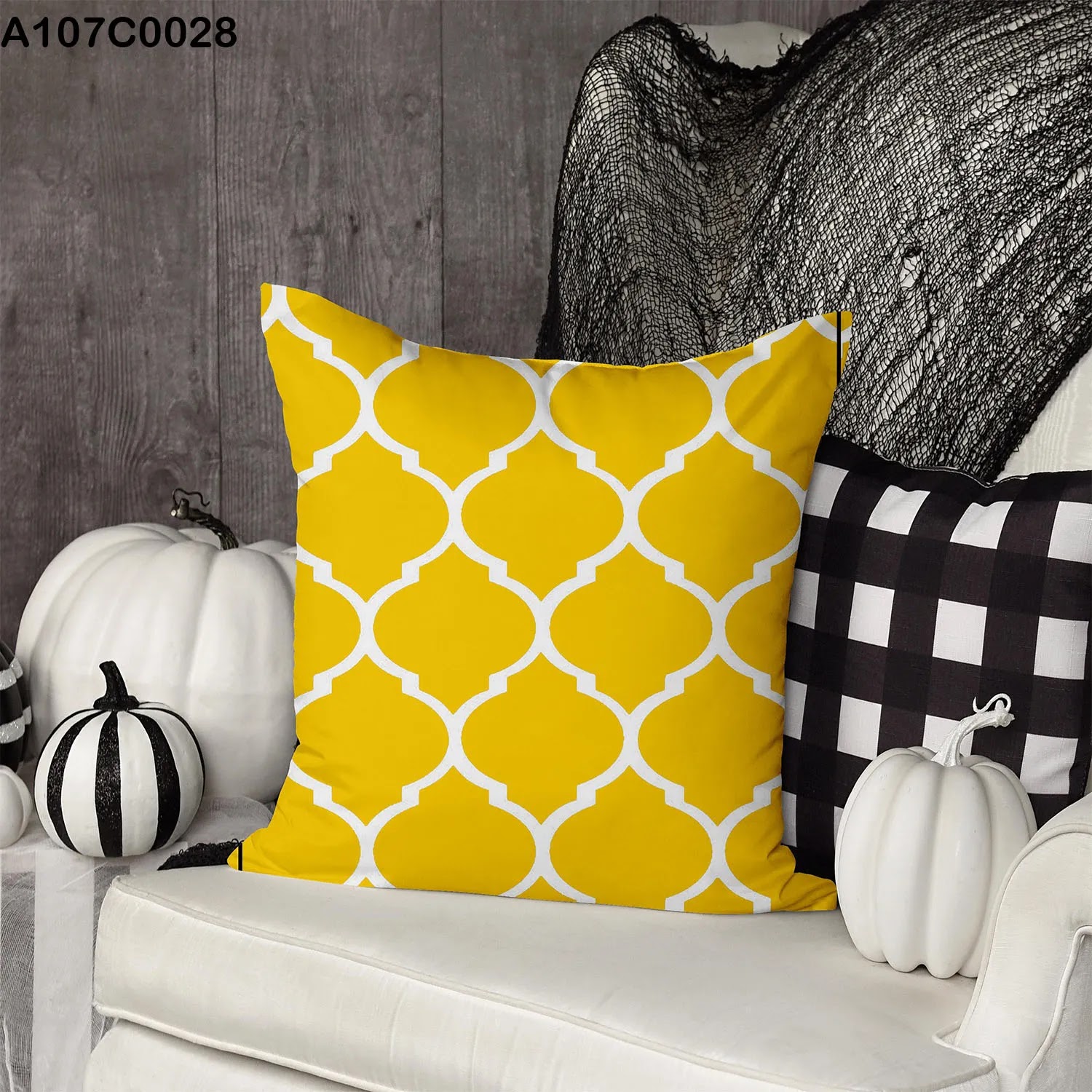 Yellow pillow case with white lines and shapes