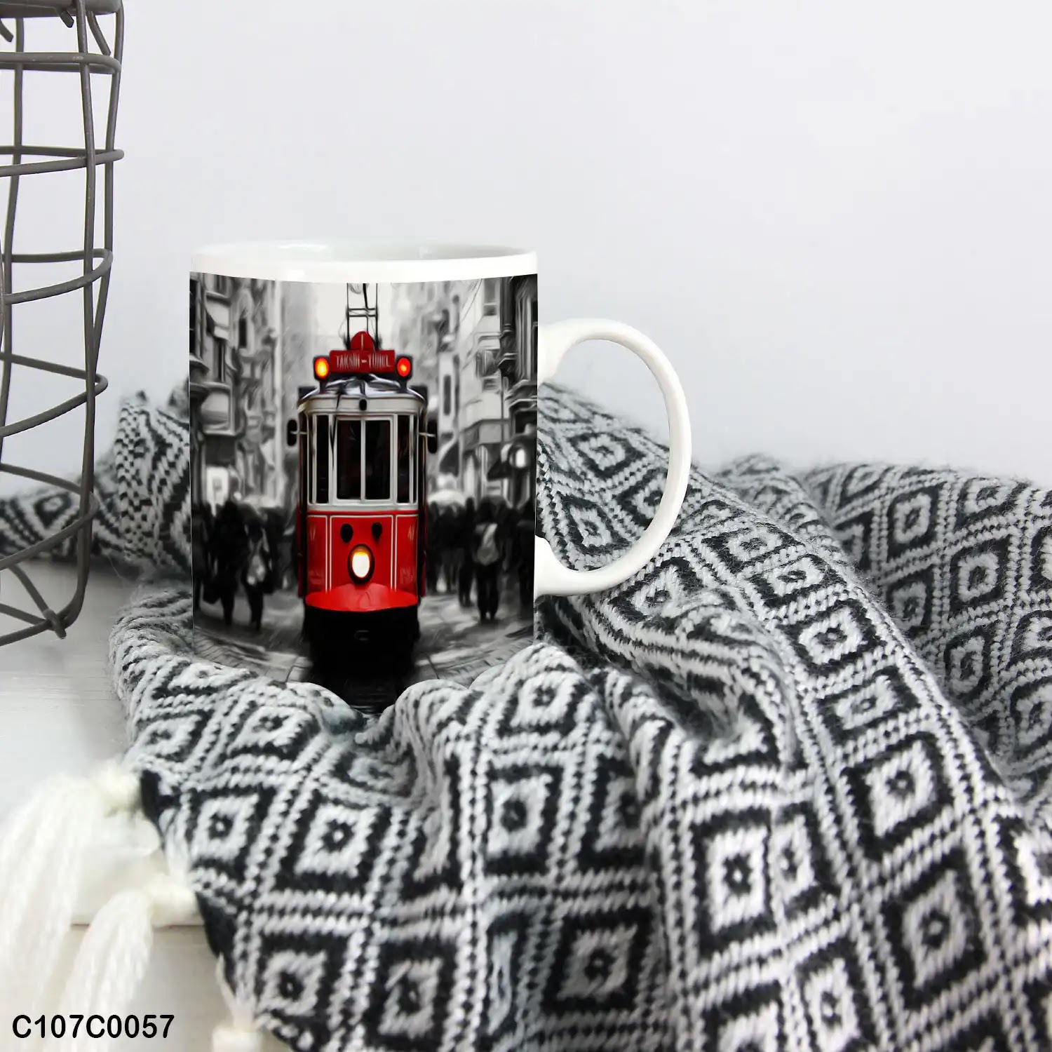 A mug (cup) printed with an image of a red tram