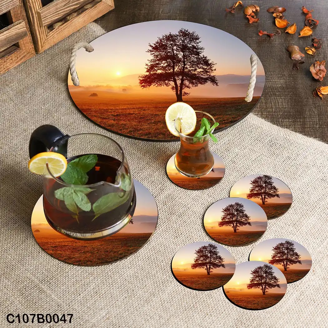 Circular tray set with a tree in field at sunrise