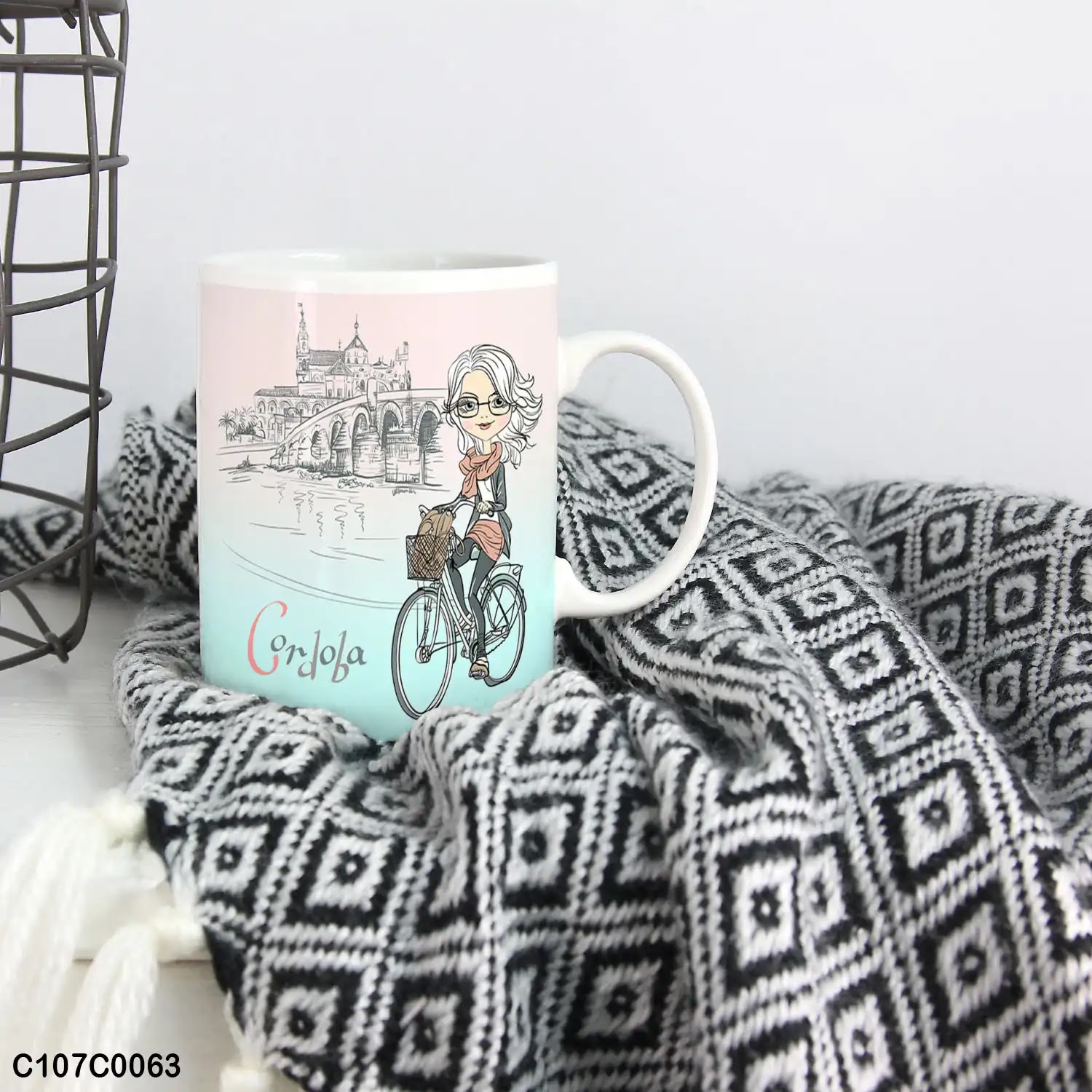 A mug (cup) printed with an image of a girl riding a bike