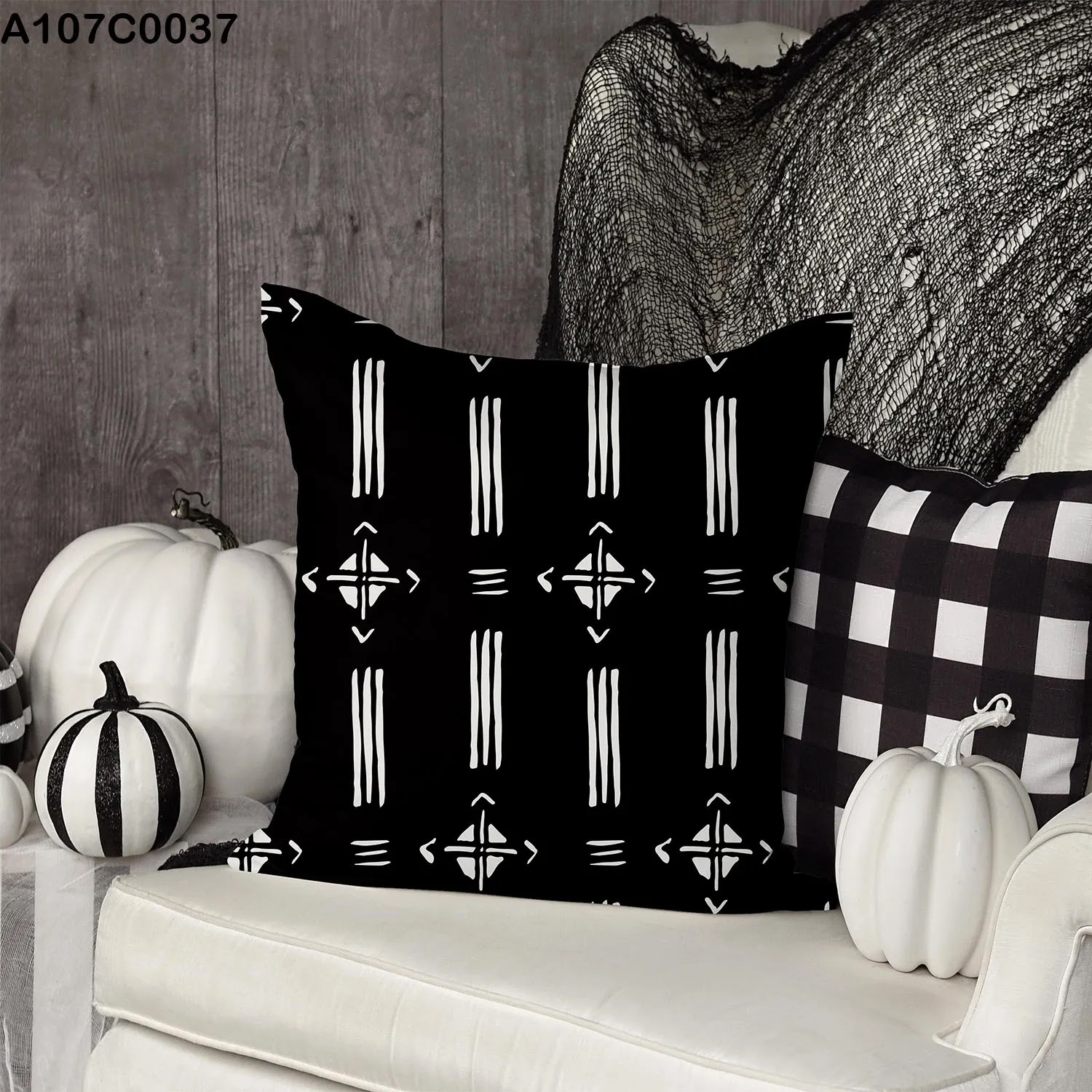Black pillow case with white lines and shpaes