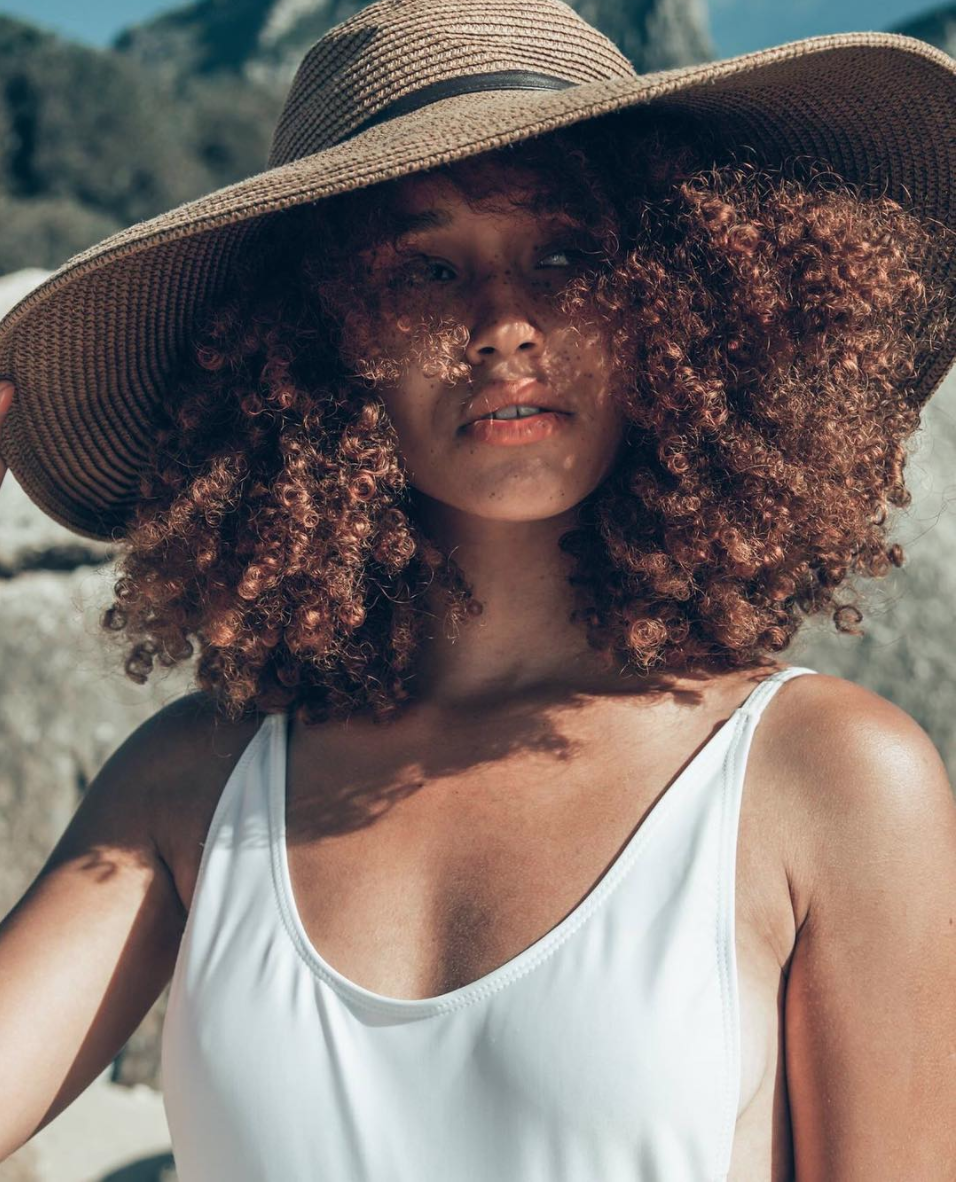 Image of Hats with curly hair