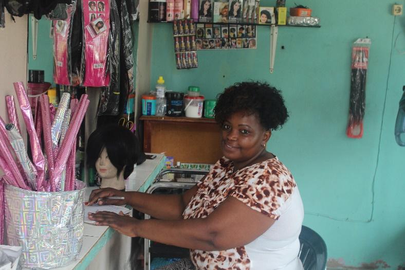 Small business owner, Gilda Lourenço, works in her salon.