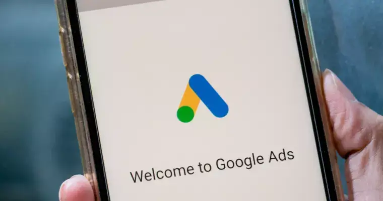 a hand holding a tablet

description automatically generated with low confidence
