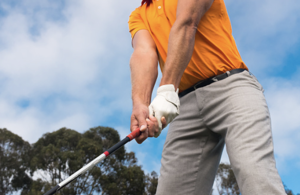 Man using strong golf grip on course