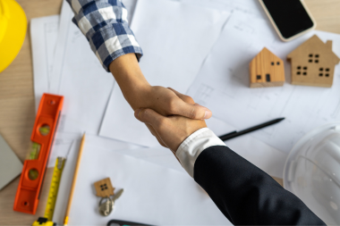 home remodeling general contractor budget agreement shaking hands custom built