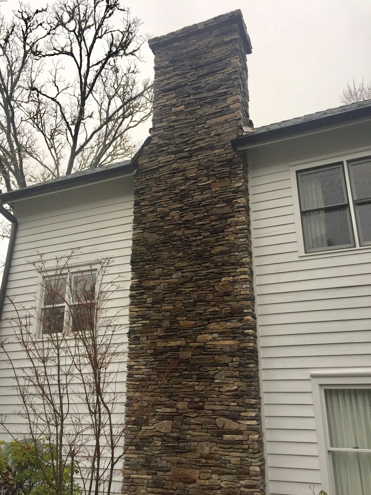 Outdoor Stone Fireplace With Chimney
