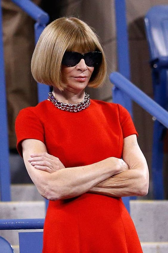 Anna Wintour in her signature style bob and dark sunglasses