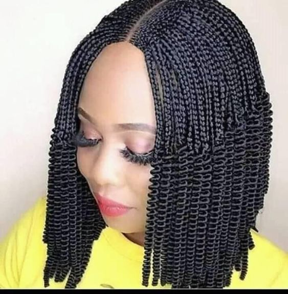 lady wearing short braids with center parting