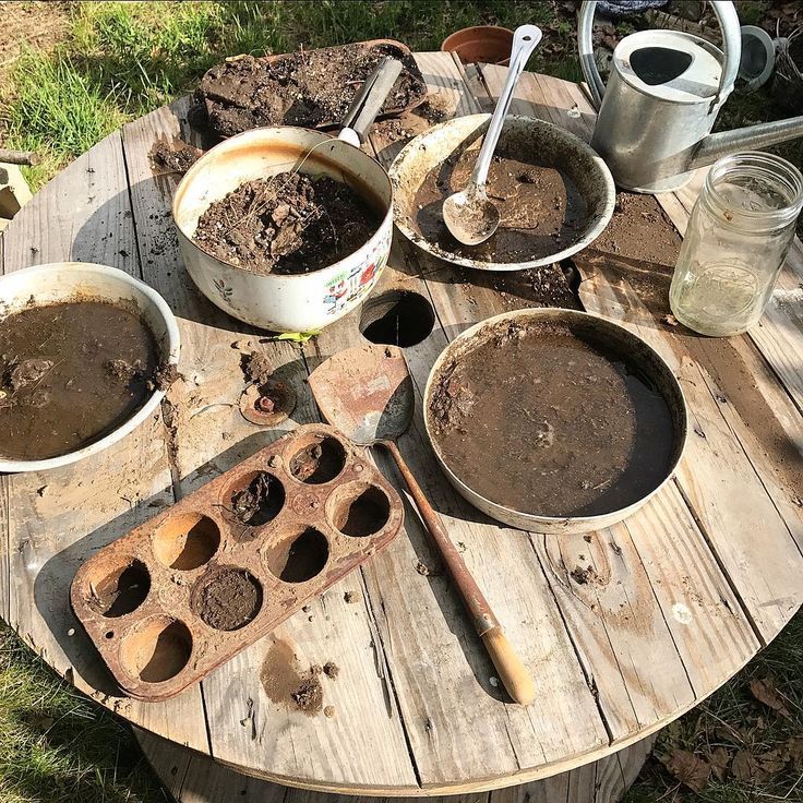 An outdoor "mud kitchen" doesn't have to be glamorous! Pots, pans ...