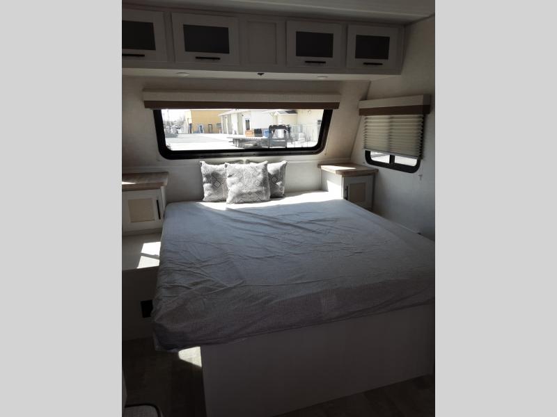 Get a great night’s sleep in the platform queen bed at the front of the RV.