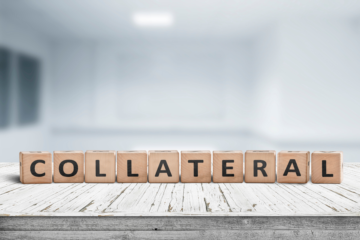 wooden blocks spelling out "collateral" in black capital letters