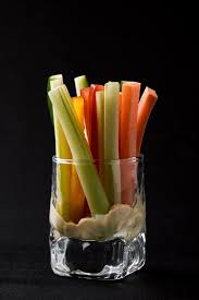 Premium Photo | Delicious juicy cucumbers, carrots, celery, cut into thin  strips or clubs, are served in a glass glass as snacks to plunge into a  spicy sauce