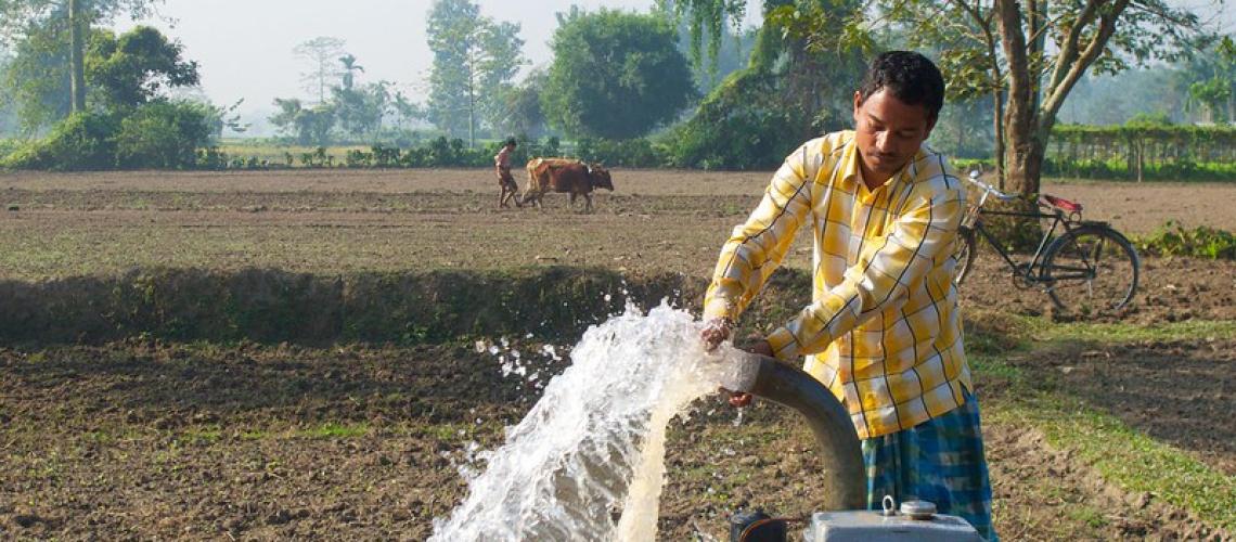 Picture of a farmer pumping water from a tubewell 