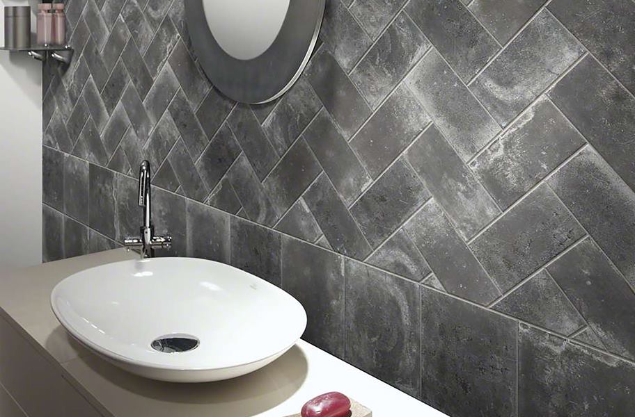 gray subway tile in herringbone pattern on wall