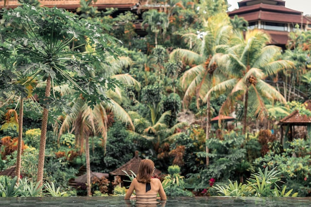 infinity pool view resort  facing lush green greenery in Bali