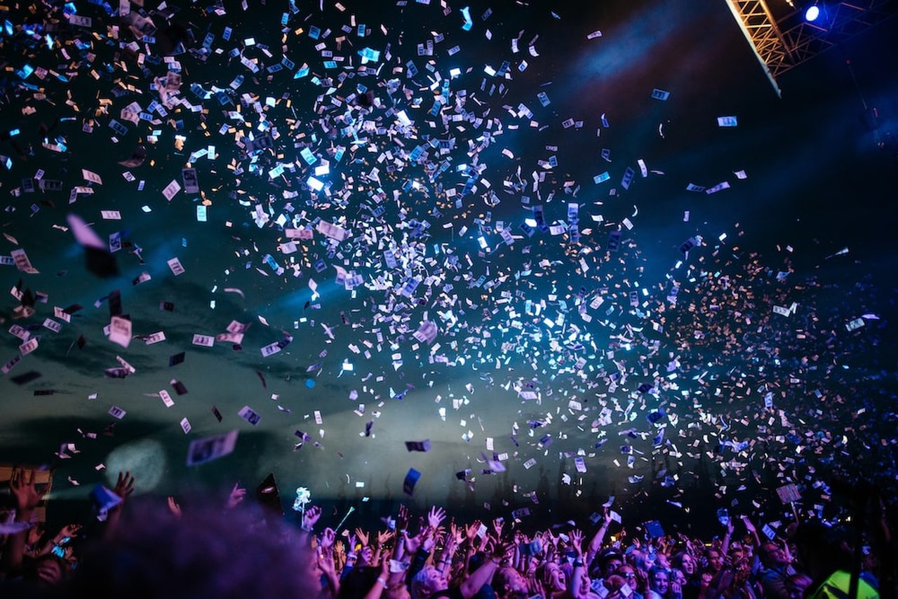 confetti on a crowd of people to celebrate