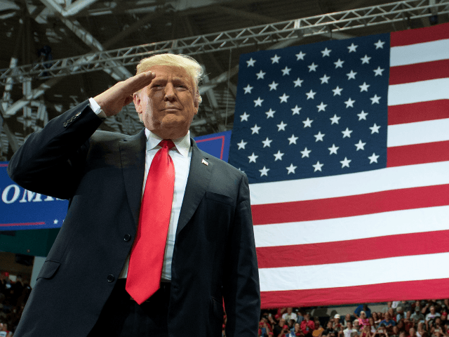 US President Donald Trump salutes as he arrives for a campaign rally in Estero, Florida, on October 31, 2018. (Photo by SAUL LOEB / AFP) (Photo credit should read SAUL LOEB/AFP/Getty Images)