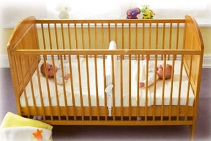 Cot bed dividers allow twins to share a cot bed