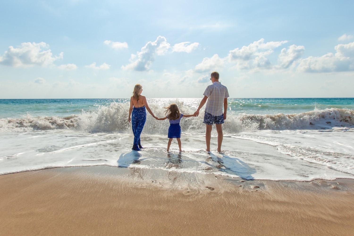 A family walking on the beach

Description automatically generated with medium confidence