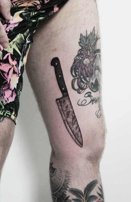 Full picture showing a guy rocking the thigh tattoo