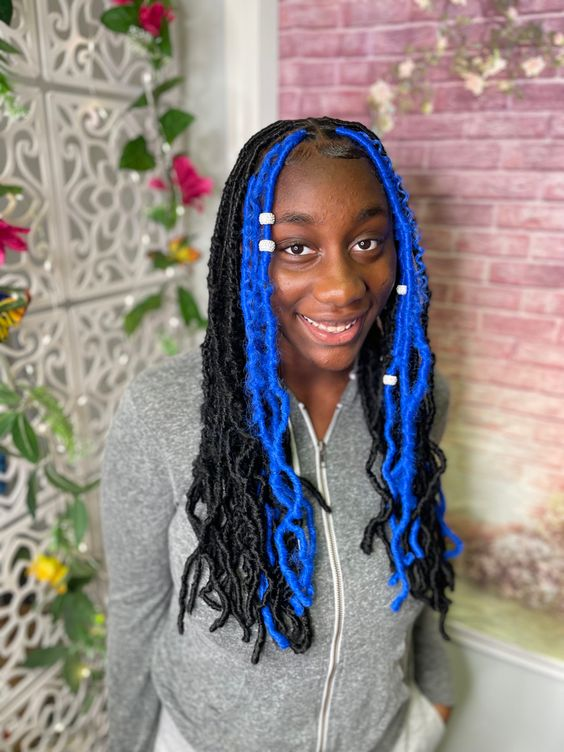 Picture of a girl wearing bead on her soft locs