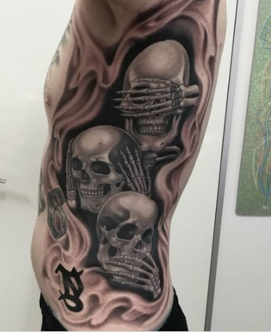 Three Skull Side Tattoo