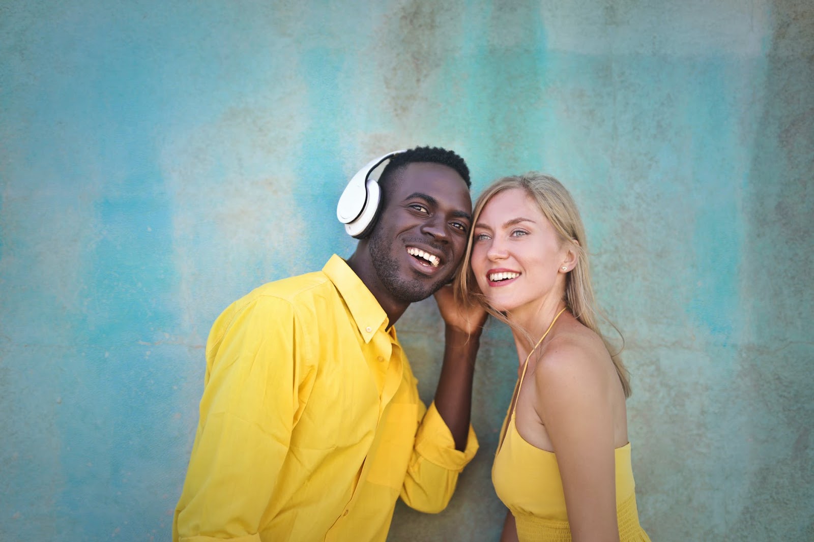 Cheerful diverse couple smiling and looking away