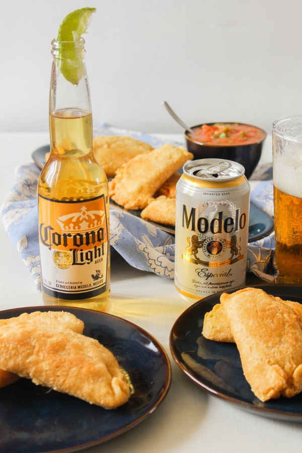 These Chicken and Corn Empanadas with Roasted Red Salsa are fun and easy to make, and are the perfect handheld treat for your Cinco de Mayo celebration!