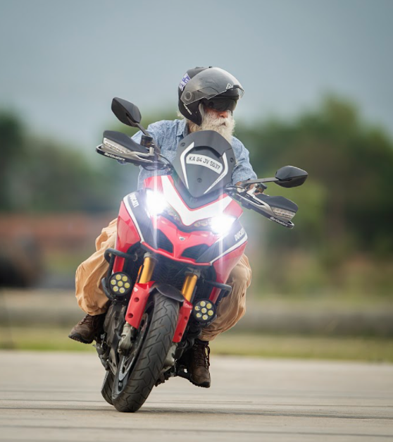 A person riding a motorcycle

Description automatically generated with medium confidence