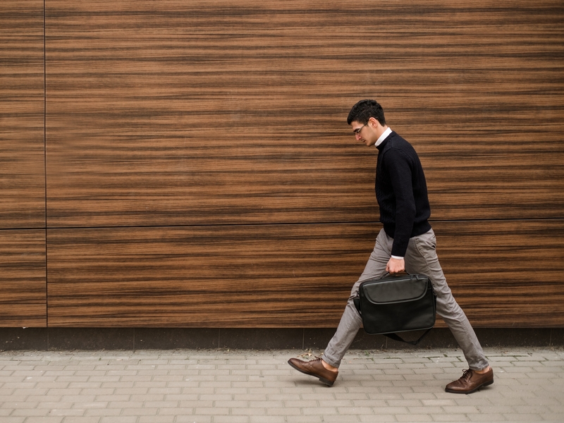 Business man walking with head down