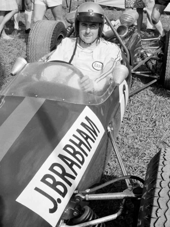 C:\Users\Valerio\Desktop\Jack Brabham sits in his car at the Warwick Farm racing circuit near Sydney in 1967..jpg