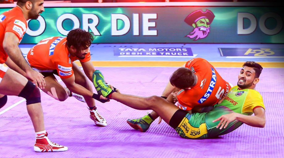 Guman Singh escapes a super tackle attempt to score five points for his side