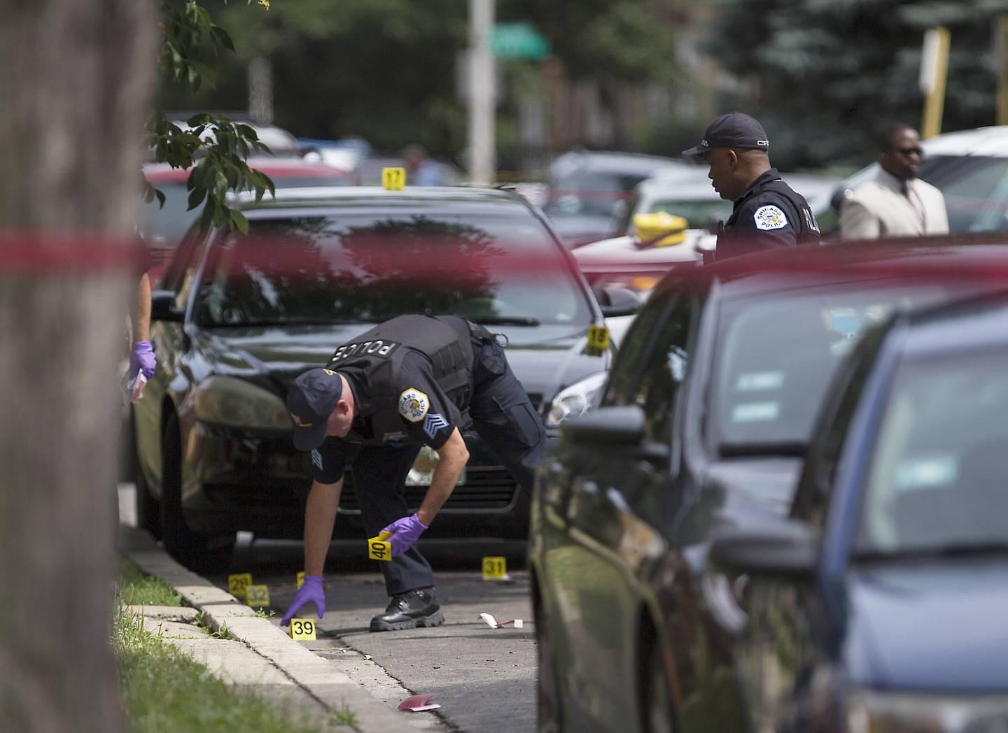 Chicago police investigate the killing of Cedron Doles in the 8100 block of South Paulina Street on July 10, 2017, in the Auburn Gresham neighborhood.