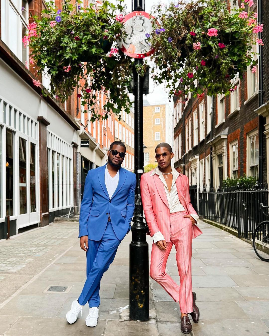 2 men rocking colorful suits