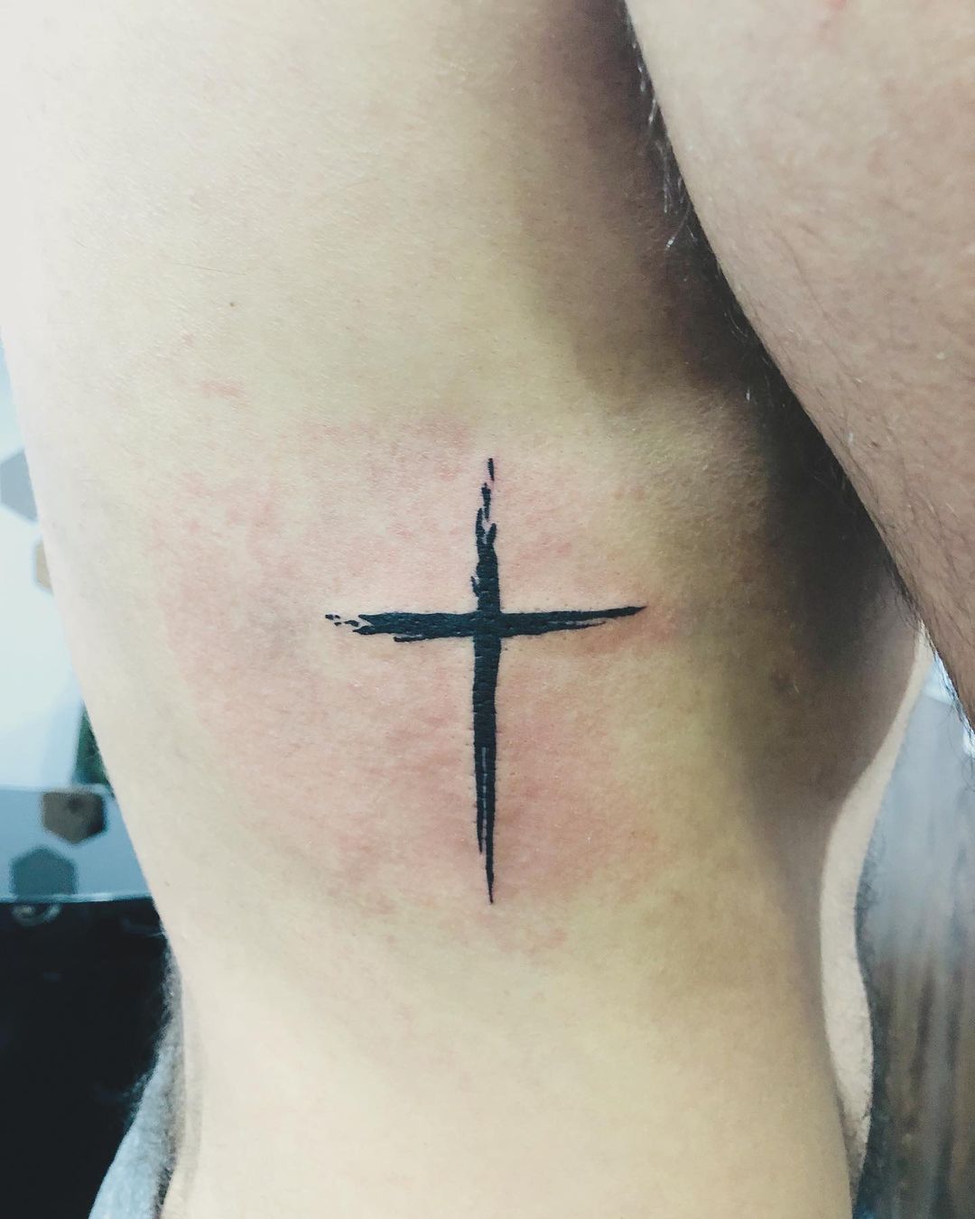 Cross Paint Tattoo on Rib