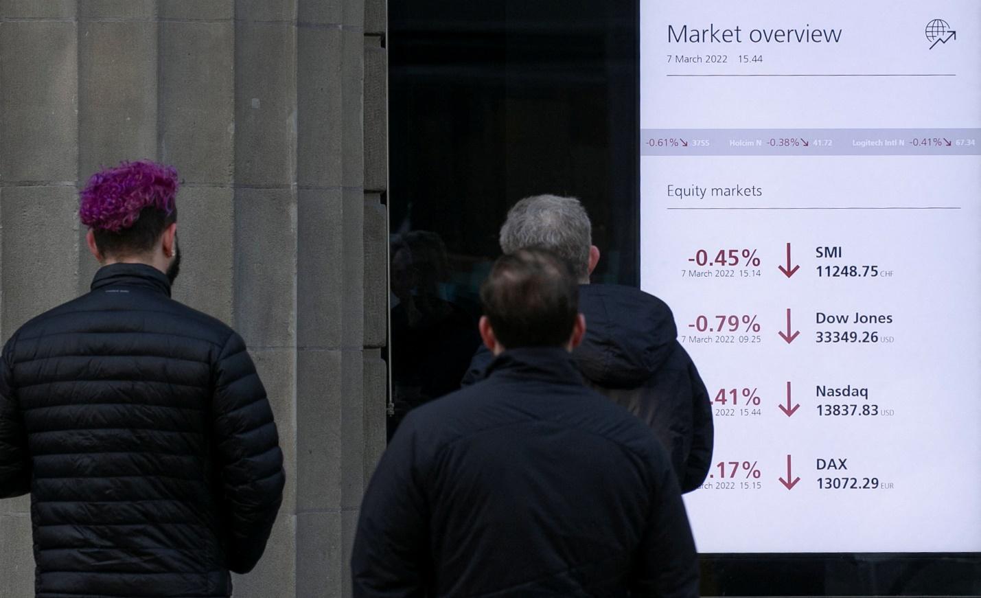 Display shows financial information in a window of the headquarters Swiss bank UBS in Zurich
