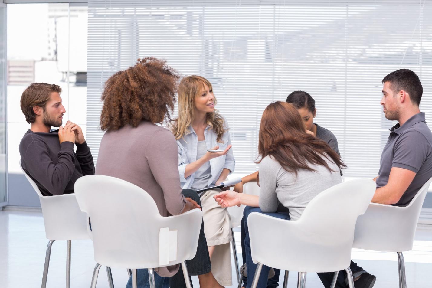 A group of people sitting in chairs

Description automatically generated with medium confidence