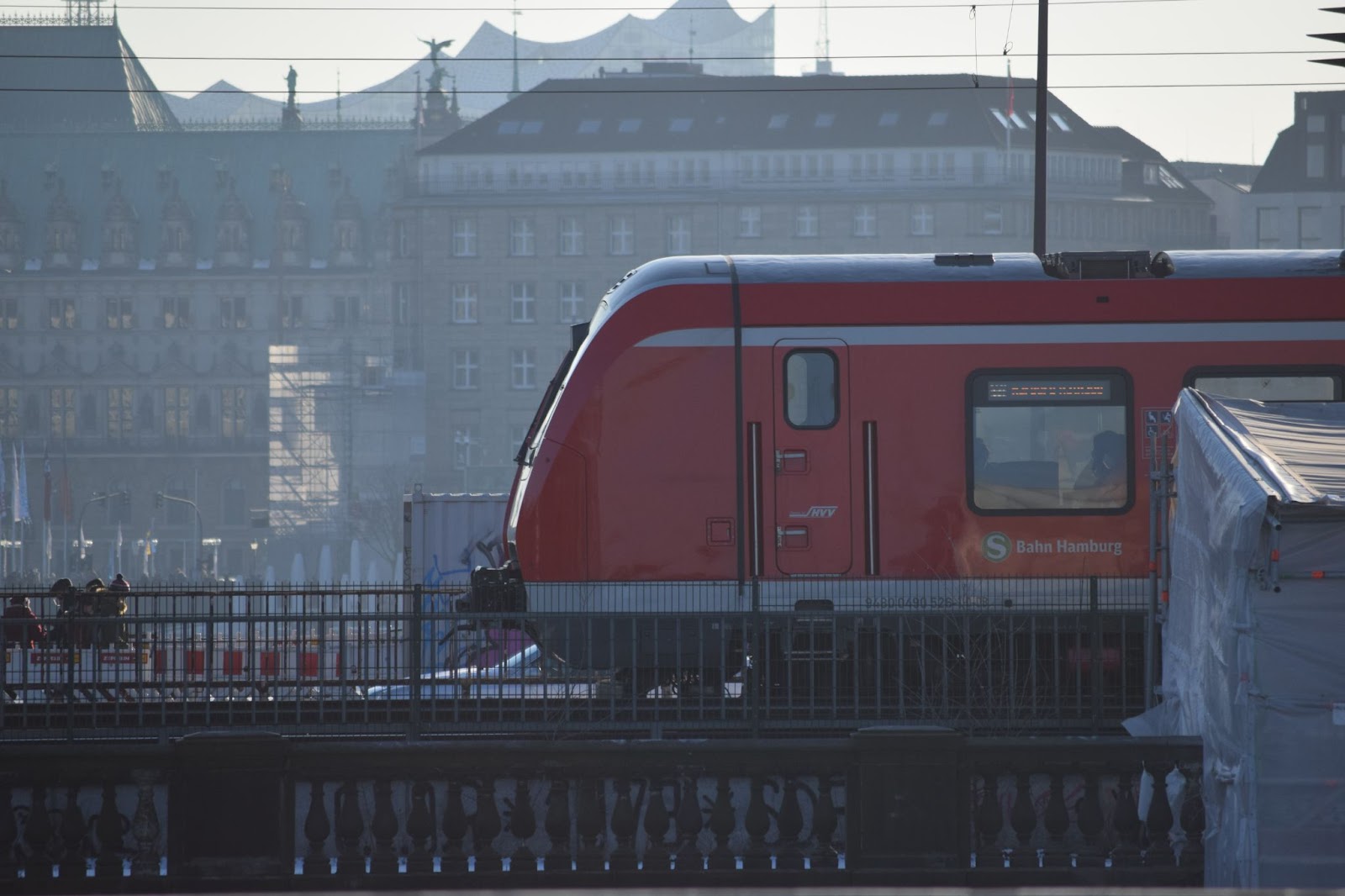 Red train on tracks in Hamburg, Germany