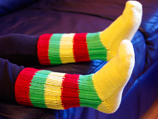 child wearing brightly colored striped socks
