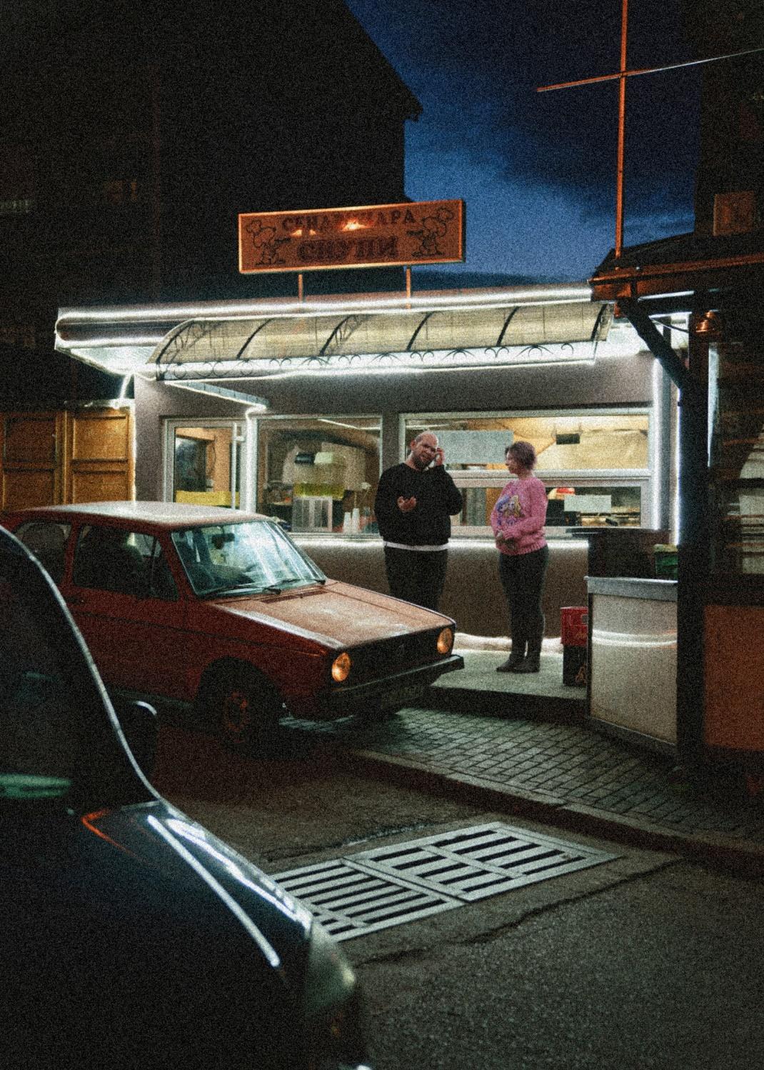 two people outside a store