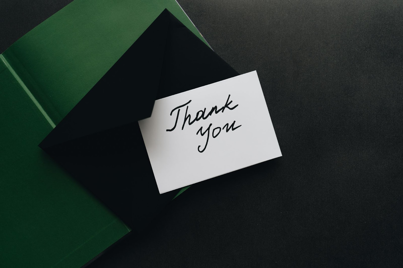 A Thank-You Message On A White Paper