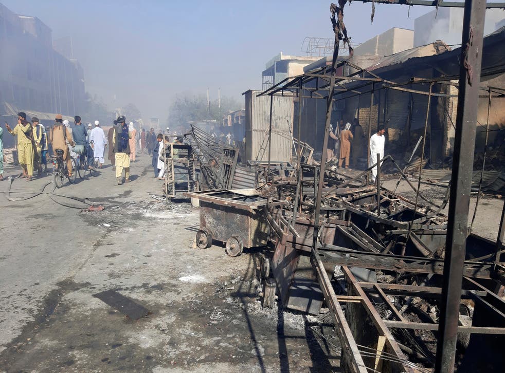 <p>Afghans inspect the damage caused by fighting between the Taliban and government forces in Kunduz, northern Afghanistan, on 8 August, 2021.</p>