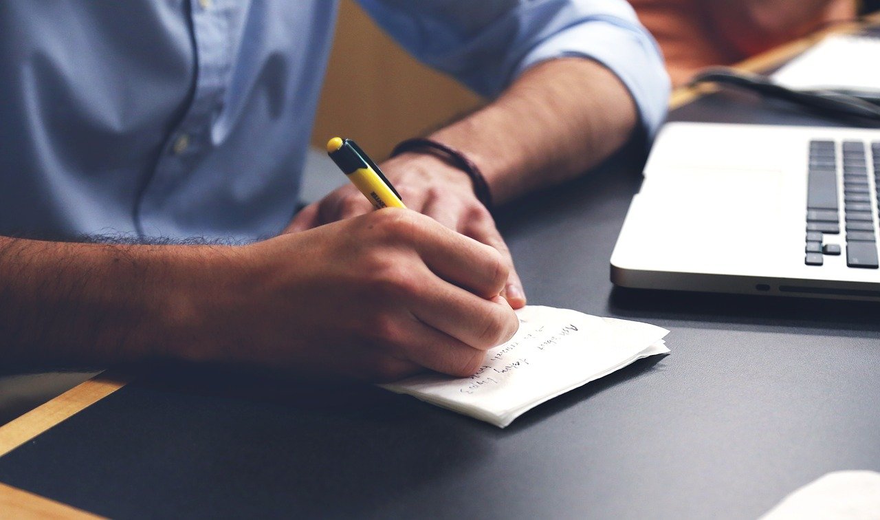 a man taking notes