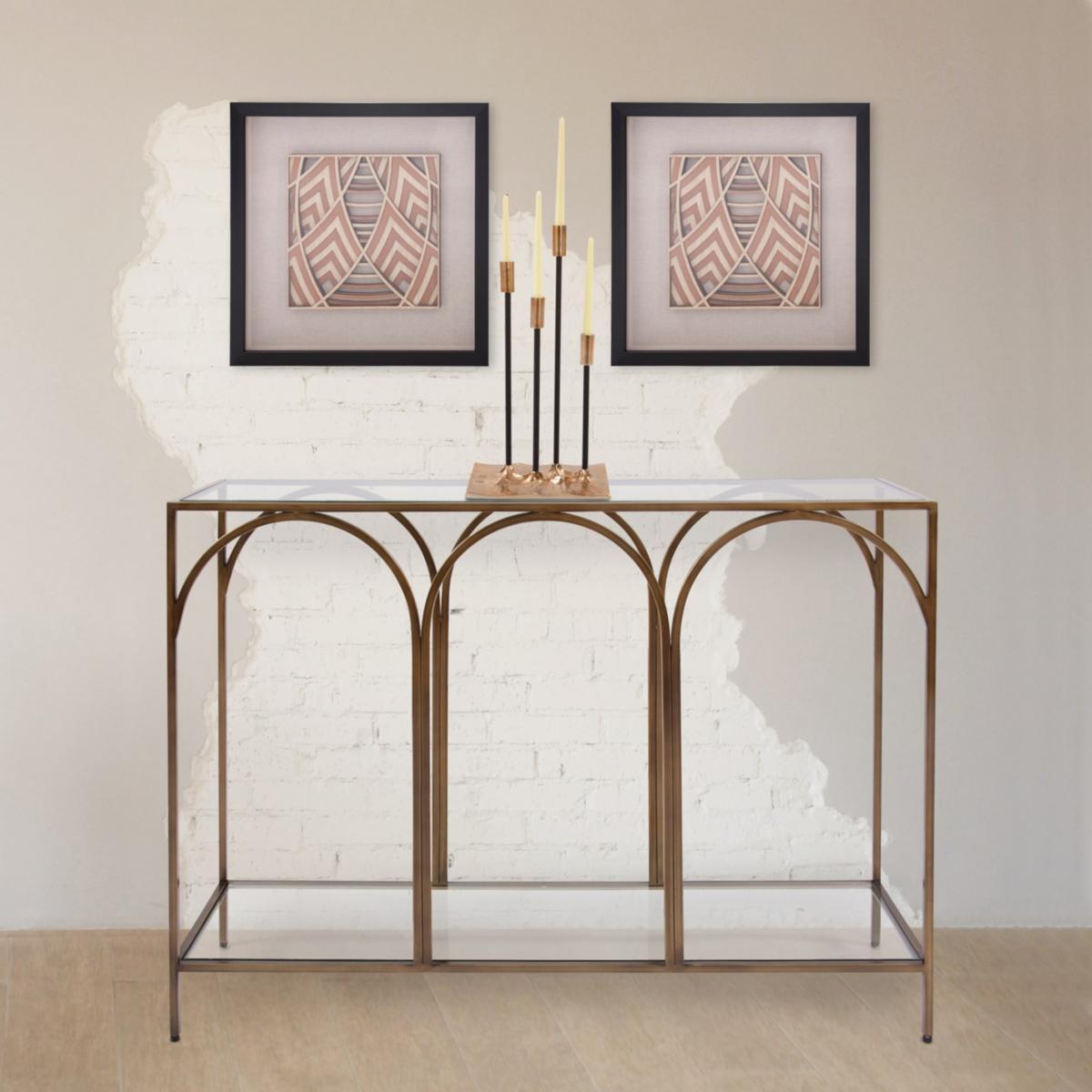 A console table with candles on it