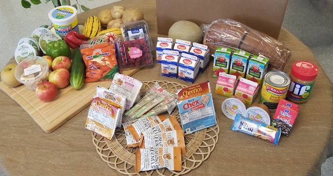 Sample meal box (each box meets USDA meal pattern equivalents for 7 days of breakfast & lunch, plus 5 days of afterschool supper).  This institution is an equal opportunity provider.