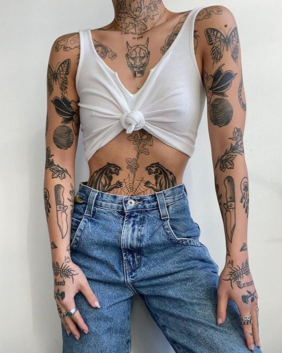 Lady shows off her full body tatted with the patchwork tat