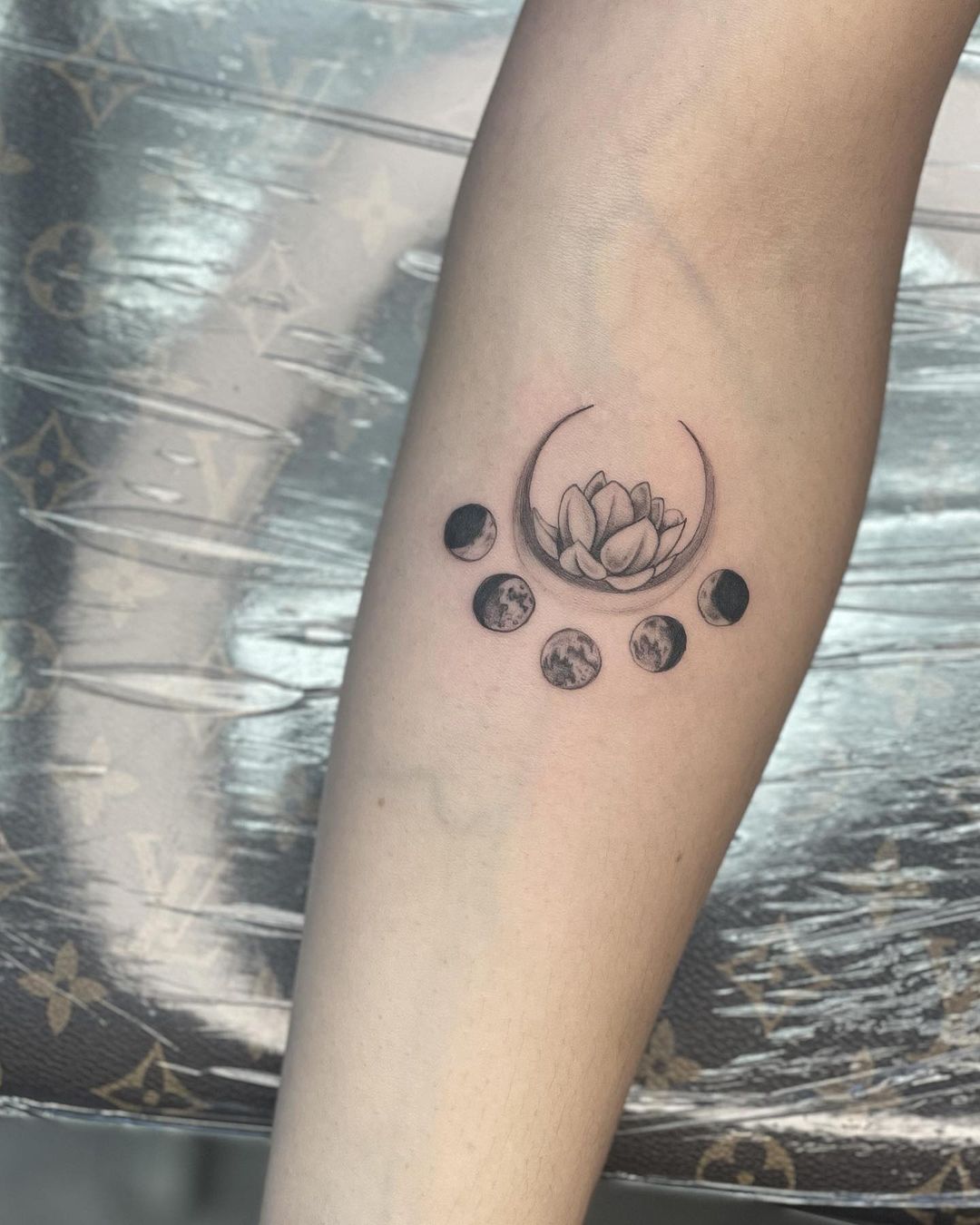 Lotus Flower With Moon Phases Tattoo