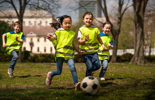 A group of kids playing football

Description automatically generated with medium confidence